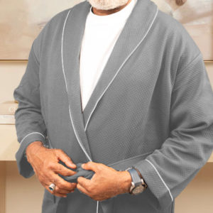 RMD wearing a neutral grey luxury shawl collar bathrobe with a pineapple pattern, designed by Esorae Home, showcasing elegance and comfort.